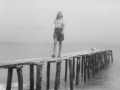 Berta on dock at Cocoloco beach (in 1950s)