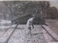 Helping my father at the copra drying rack