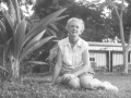 Mama next to coconut seedling at Casalata